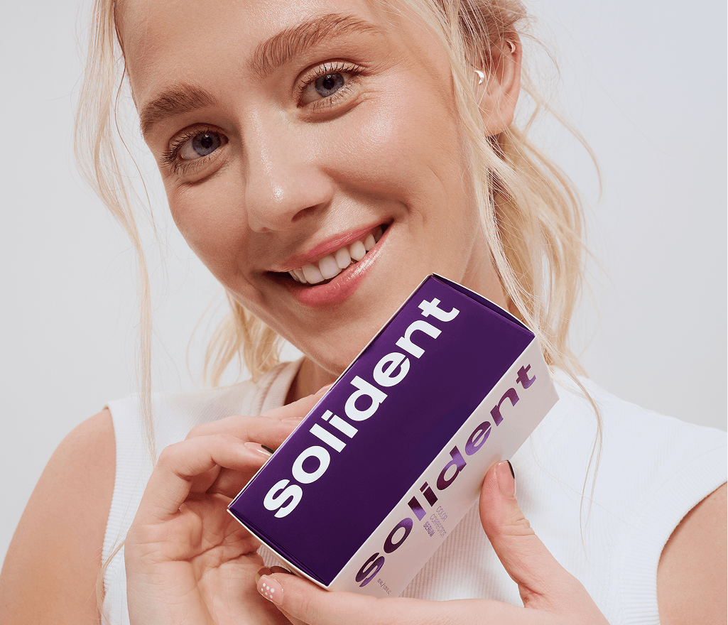 Woman holding a solident product